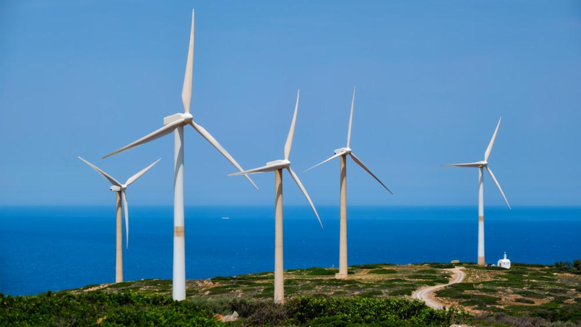 Green renewable alternative energy concept wind generator turbines generating electricity on Crete, Greece